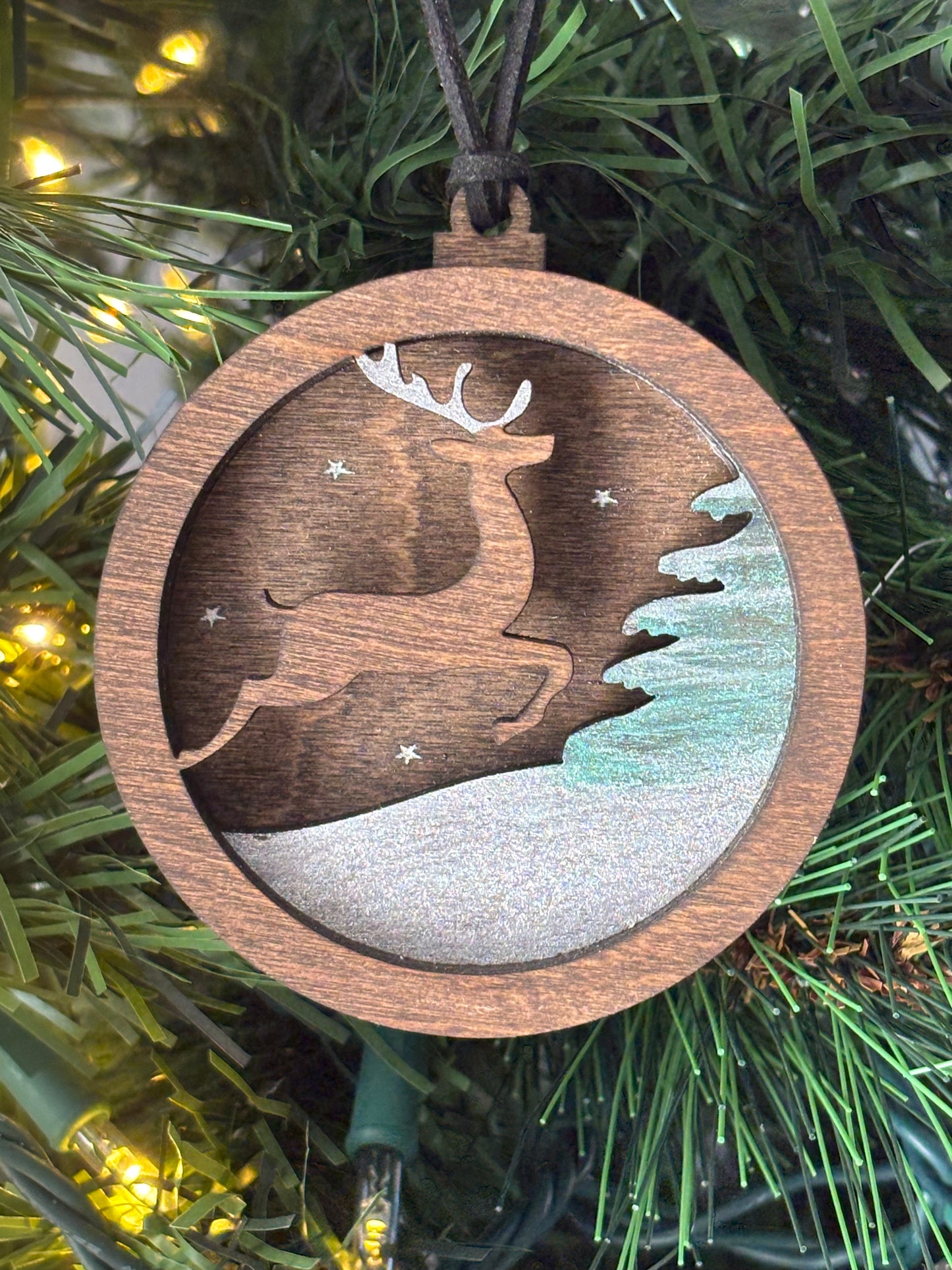 3D Layered Ornament Featuring Leaping Deer in Snow